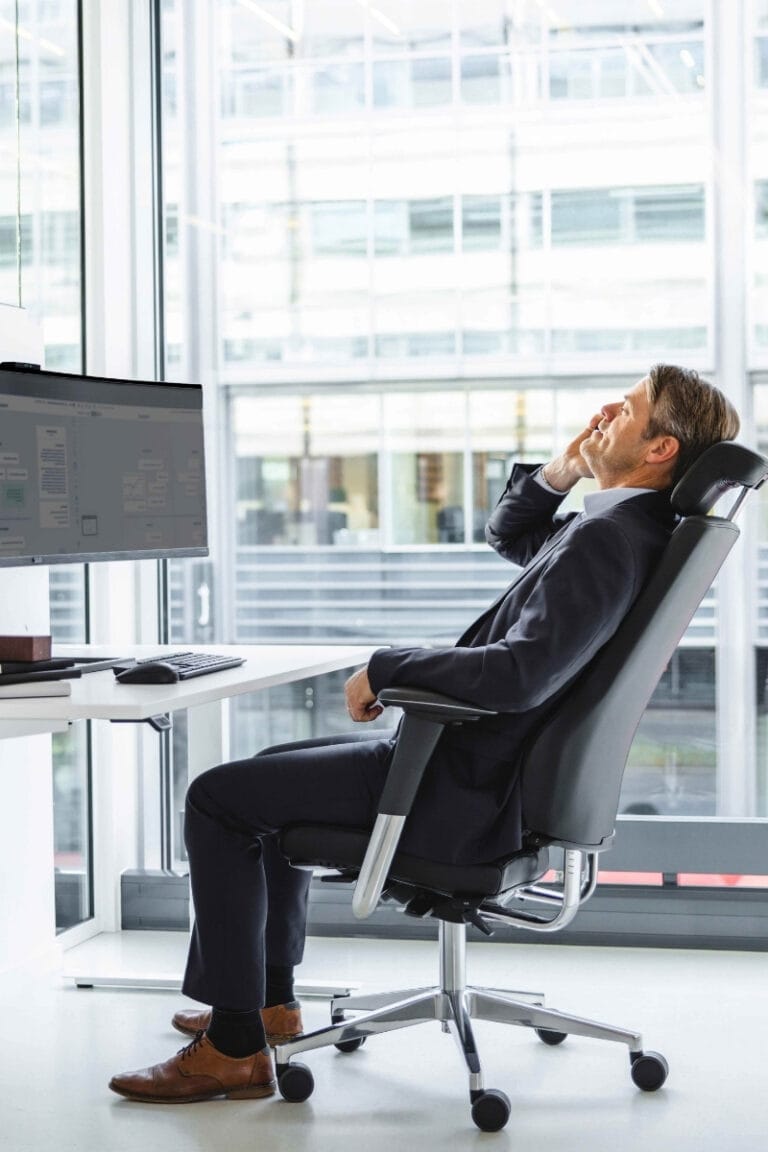 image of a man showing how to sit properly at work