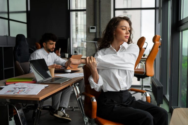 female staff stretching in the office as a result of hypermobility